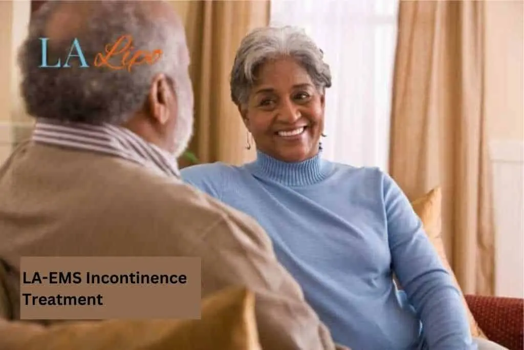 Couple sat smiling at each other - LA-EMS treatment Malvern Wells