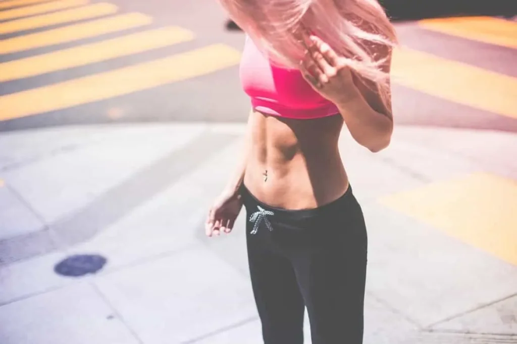 Woman with toned stomach after LA-EMS Body Sculpting Treatment Malvern Wells